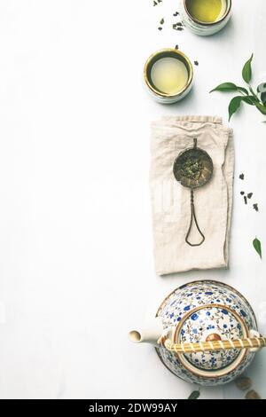 Tea composition, green tea on grey concrete background, flat lay Stock Photo