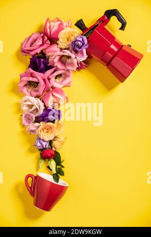 Morning coffee concept. Coffee maker, coffee cup and flowers on yellow background. Flat lay Stock Photo