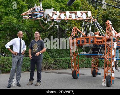 U.S. President Barack Obama (L) examines a robotic giraffe with Lindsay Lawlor of San Diego, California, at the White House Maker Faire projects on the South Lawn, June 18, 2014, in Washington, DC, USA. The Faire is a series of projects by students, entrepreneurs and regular citizens using new technologies and tools to launch new businesses and learning new skills in science, technology, engineering and mathematics. Photo by Mike Theiler/Pool/ABACAPRESS.COM Stock Photo