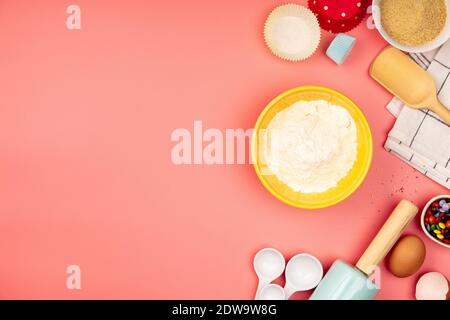 Baking or cooking background frame. Ingredients, kitchen items for baking. Kitchen utensils, flour, eggs, sugar. Text space, top view. Stock Photo