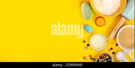 Baking or cooking background frame. Ingredients, kitchen items for baking. Kitchen utensils, flour, eggs, sugar. Text space, top view. Stock Photo