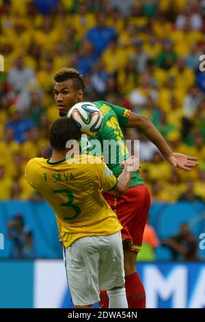 Brazil's Thiago Silva battling Cameroon's Eric-Maxim Choupo-Moting in Soccer World Cup 2014 First round Group A match Brazil vs Cameroon in National Stadium, Brazilia, Brazil on June 23rd, 2014. Brazil won 4-1. Photo by Henri Szwarc/ABACAPRESS.COM Stock Photo