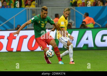 BBrazil's Neymar battling Cameroon's Eric-Maxim Choupo-Moting in Soccer World Cup 2014 First round Group A match Brazil vs Cameroon in National Stadium, Brazilia, Brazil on June 23rd, 2014. Brazil won 4-1. Photo by Henri Szwarc/ABACAPRESS.COM Stock Photo