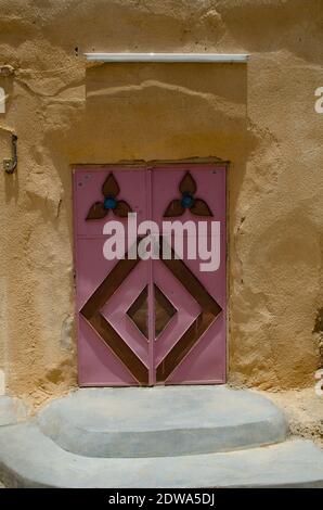 Pretty and colorful doors of traditional Omani houses in the villages of Jebal Akdar, OmanOften overlooked as a potential travel destination and yet its rich history and centuries old culture that has so much to offer. Oman is an incredibly diverse landscape of tropical palm fringed wades, remote deserts and green terraced mountains, thriving Souks and one of the most welcoming people of the Arabian Gulf region and must deserve further attention. Stock Photo