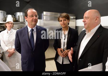 French President Francois Hollande, Najat Vallaud-Belkacem and Thierry Marx. visiting the 'Cuisine Mode d'emploi' a school for training in the restoration in Paris, France on June 24, 2014. Photo by Jacques Witt/Pool/ABACAPRESS.COM Stock Photo