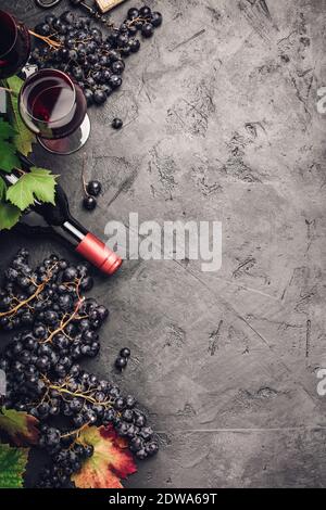 Wine with grapes, leaves and corks on dark background, copyspace, flat lay Stock Photo