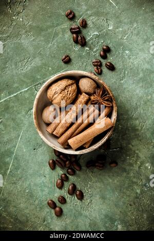 Set of spices and coffee beans on rustic background Stock Photo