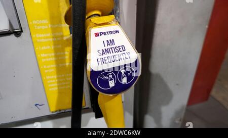 RAwang, Selangor, Malaysia, 23rd December 2020 - fuel pumps at a gas station. that has been sanitize due to the pandemic covid 19 Stock Photo