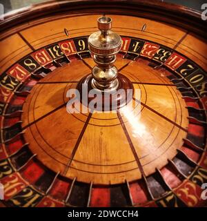 A photo of a vintage wooden roulette wheel. Stock Photo