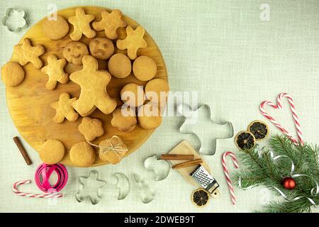 Christmas cookies and cookie cutters on the table. Metal cookie cutters. Molds for home baking. Stock Photo