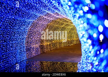 blue lighting tunnel with reflection on ground Stock Photo