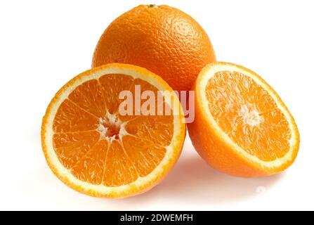 Whole and sliced ripe oranges isolated on white background Stock Photo