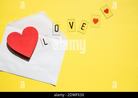 Opened envelope and many felt hearts.Copy space Stock Photo