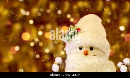 toy Snowman, on the background of Christmas lights Stock Photo
