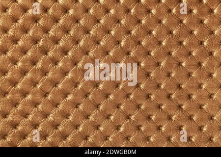 Texture of dark brown leather background with capitone pattern, macro. Copper and rusty color textile of retro Chesterfield style. Vintage fabric back Stock Photo
