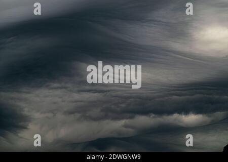 a close up image of dark grey storm clouds over the Mediterranean sea Stock Photo