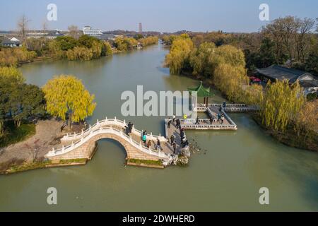 Tourists visit the Slender West Lake scenic area in Yangzhou, east ...