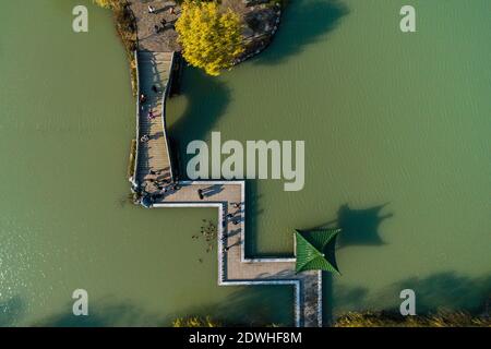 Tourists visit the Slender West Lake scenic area in Yangzhou, east ...