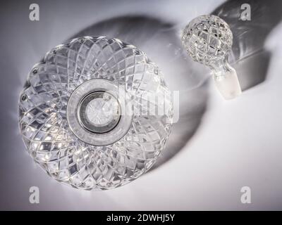 Empty Ships Decanter seen from above with shadow of glass on background. Stock Photo