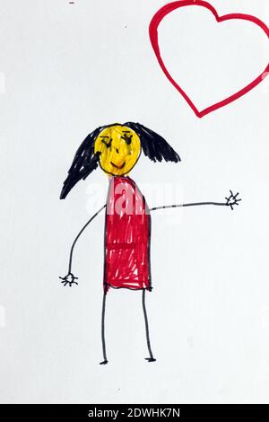 Seven year old child's drawing, happy girl in red dress and empty heart for text. Stock Photo