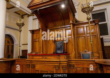 View towards Judges bench inside one of the preserved Victorian courtroom in National Justice Museum, Nottingham, Nottinghamshire, UK. Stock Photo