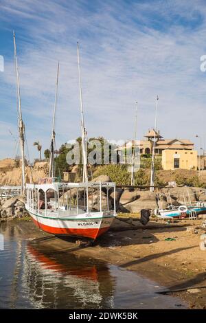 Egypt, Upper Egypt, Aswan, Nubian village on Elephantine Island - Khnum ruins museum in background Stock Photo