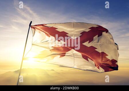 Chuquisaca department of Bolivia flag waving on the top sunrise mist fog Stock Photo