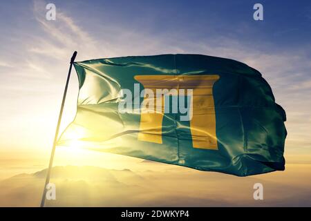 Qena governorate of Egypt flag waving on the top sunrise mist fog Stock Photo