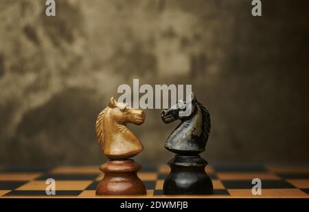 Knights chess pieces facing each other Stock Photo