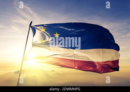 Gagauzia Territorial Unit of Moldova flag waving on the top sunrise mist fog Stock Photo