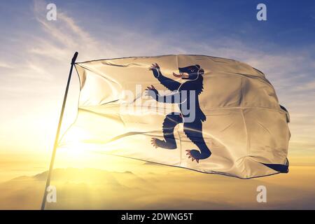 Appenzell Innerrhoden canton of Switzerland flag waving sunrise mist fog Stock Photo