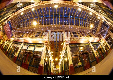 London, UK. - 20 Dec 2020: Wide-angled image of part of Leadenhall Market in the City of London, designed by Horace Jones and dating from the late C.19, decorated for the Christmas 2020 festive season.