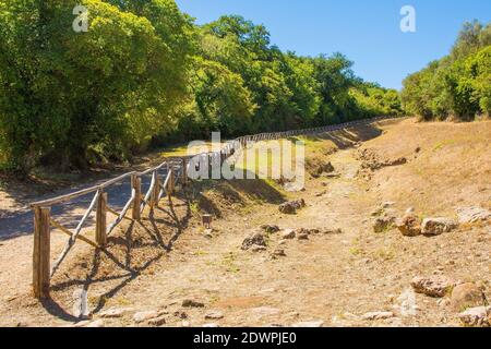 Grosseto, Italy - September 4th 2020. The ruins of  the Paved Etruscan Road in Roselle or Rusellae, an ancient Etruscan and Roman city in Tuscany. Stock Photo