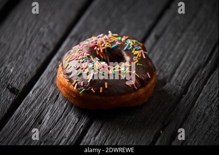 Colorful donuts on stone table. Top view with copy space Stock Photo