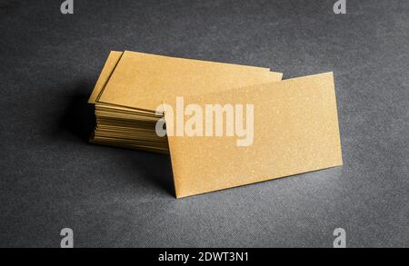 Stack of blank golden business card on grey background. Blank name card. Stock Photo