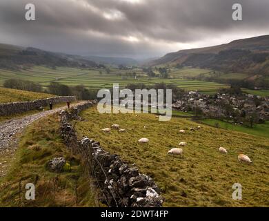 A rainy December day in Wharfedale, Yorkshire Dales National Park, UK. Kettlewell villages lies at the bottom of the hill. Stock Photo