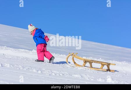 Funny afternoon in wintertime on sleigh with family Stock Photo