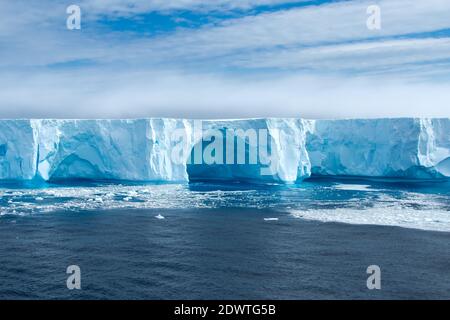 Beautiful blue iceberg and ice floe in Admiralty Bay, Antarctica. Stock Photo