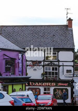 Two public houses in centre of a village in Ireland. The Carlingford Arms (left) and Ma Bakers, Irish pubs in Carlingford village, County Louth. Stock Photo