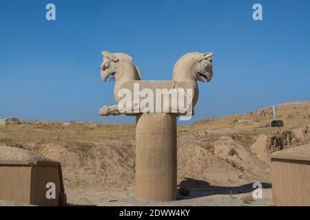 Stone statue of Zoomorphic griffin (Twin Homa or Huma bird figures) in the Persepolis in Shiraz, Iran. The ceremonial capital of the Achaemenid Empire Stock Photo