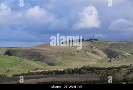 View from Morgans Hill towards the Lansdowne monument on Cherhill Down with sun dappled downs in the foreground,Wiltshire.UK Stock Photo