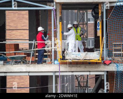 November, 16 2020, in Madrid, Spain some workers working in construction during the pandemic Stock Photo