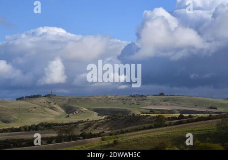 View from Morgans Hill towards the Lansdowne monument on Cherhill Down with sun dappled Calstone Down in the foreground,Wiltshire.UK Stock Photo