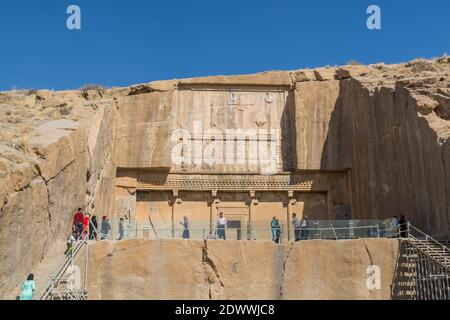 Tourists visiting the Tomb of Artaxerxes II in the Persepolis in Shiraz, Iran. The ceremonial capital of the Achaemenid Empire. UNESCO World Heritage Stock Photo