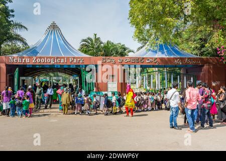 tourists and a group of Indian primary school pupils waiting for entering the Nehru Zoological park in Hyderabad City, Andhra Pradesh,  India Stock Photo