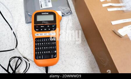 Rawang, Selangor, Malaysia, 23rd December 2020 - Brother brand handheld label printer on a data center floor background Stock Photo