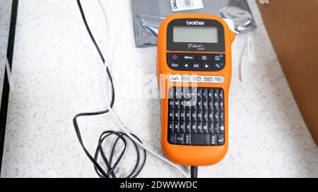 Rawang, Selangor, Malaysia, 23rd December 2020 - Brother brand handheld label printer on a data center floor background Stock Photo
