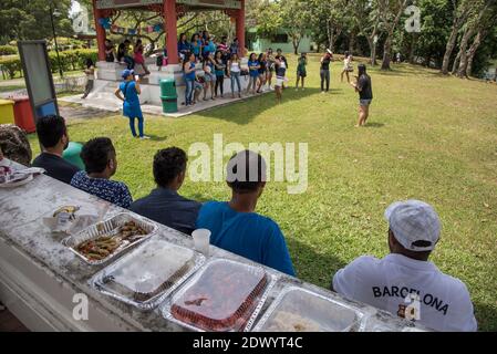 Foreign Bangladeshi migrant workers relaxing on their Sunday day off in Singapore Stock Photo