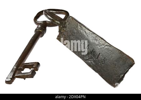vintage hand-forged key with fob ‘PARIS’ isolated on white background Stock Photo