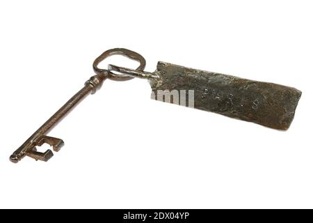 vintage hand-forged key with fob ‘PARIS’ isolated on white background Stock Photo